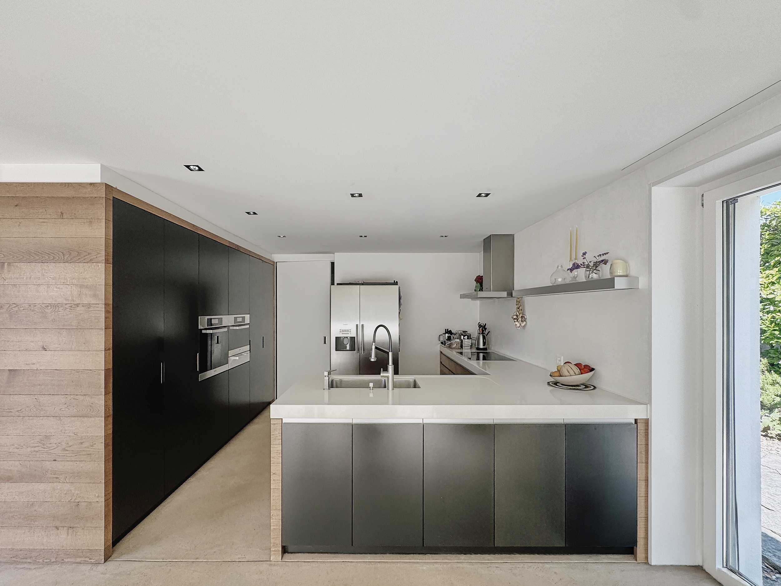 Modern, bright kitchen with wooden finish.