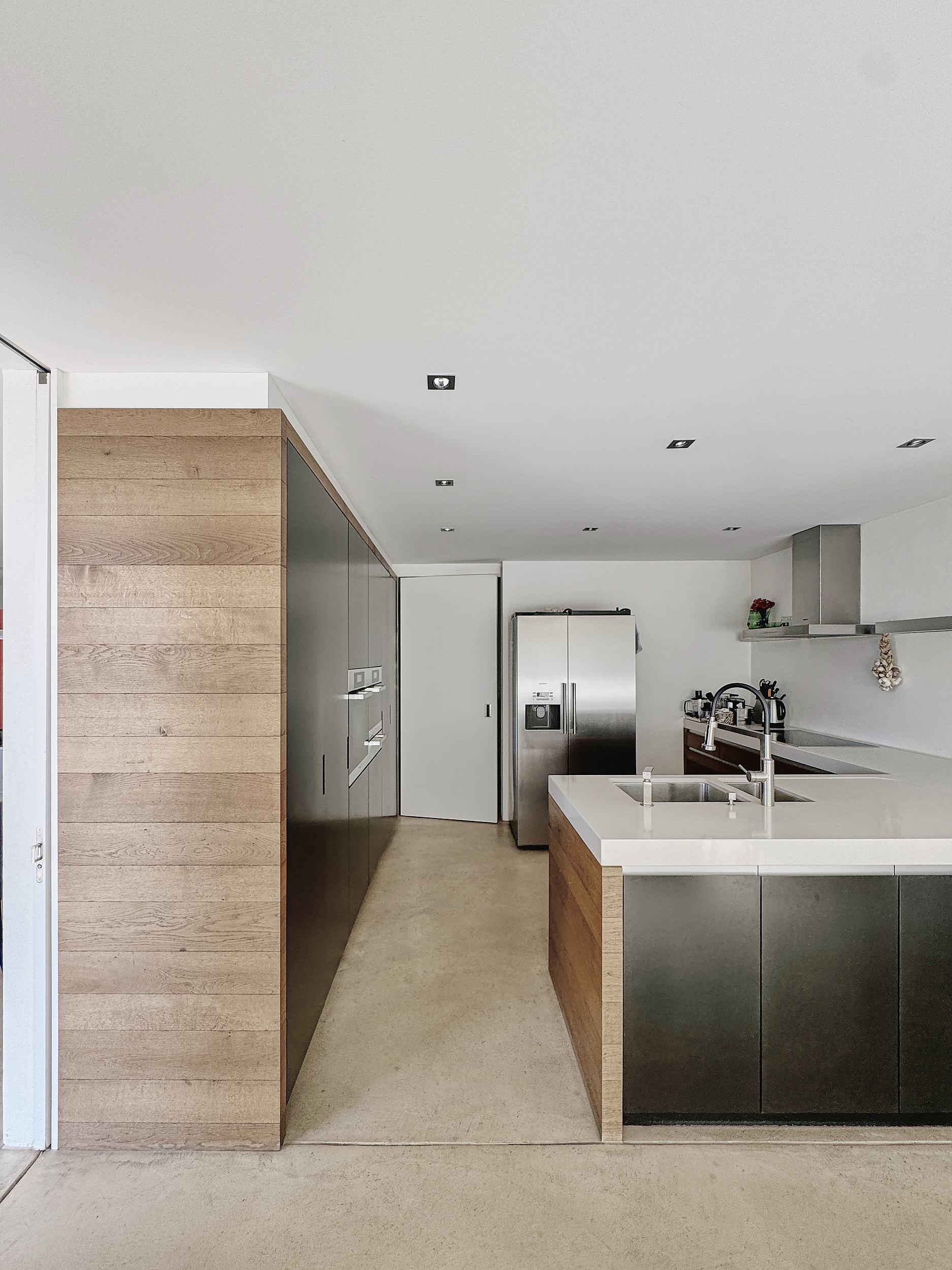 Modern, bright kitchen with wooden finish.