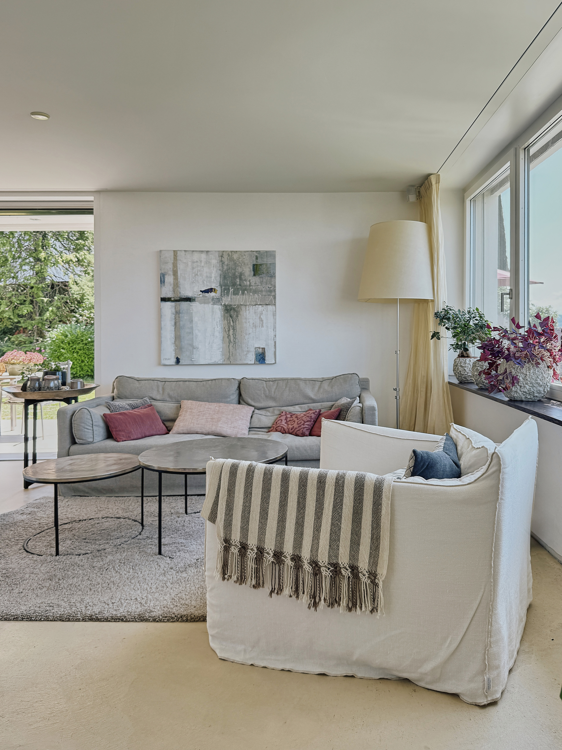 Living room with sofas and large windows